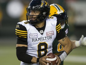 Hamilton Tiger-Cats quarterback Jeremiah Masoli (8) runs with the ball against the Edmonton Eskimos on June 22, 2018, in Edmonton.