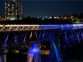 The High Level Bridge seen lit up in gold, blue and white to honour the Edmonton Stingers, repeat Canadian Elite Basketball League champions, in Edmonton, on Monday, Aug. 30, 2021. The city's refusal to light up the High Level Bridge for an anti-abortion rally two years ago didn't violate the group's constitutional rights, a Court of Queens Bench Justice has ruled.