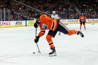 Edmonton Oilers' Jesse Puljujarvi (13) shoots on Vancouver Canucks' Jaroslav Halak (41) during the first period of preseason NHL action at Rogers Place in Edmonton, on Thursday, Oct. 7, 2021. Photo by Ian Kucerak