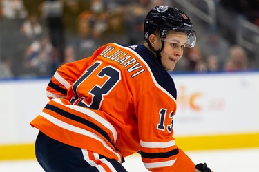 Edmonton Oilers' Jesse Puljujarvi (13) is seen during a faceoff with the Vancouver Canucks during the second period of preseason NHL action at Rogers Place in Edmonton, on Thursday, Oct. 7, 2021.