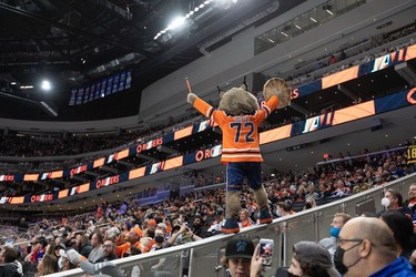 Edmonton Oilers mascot Hunter celebrates a goal with fans by Leon Draisaitl (29) on the Vancouver Canucks during the first period of preseason NHL action at Rogers Place in Edmonton, on Thursday, Oct. 7, 2021.