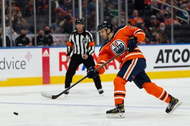 Edmonton Oilers' Evan Bouchard (75) fires a slapshot on Vancouver Canucks' Jaroslav Halak (41) during the third period of preseason NHL action at Rogers Place in Edmonton, on Thursday, Oct. 7, 2021.