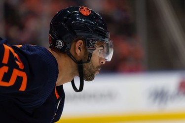 Edmonton Oilers' Darnell Nurse (25) faces off against the Calgary Flames during second period NHL action at Rogers Place in Edmonton, on Saturday, Oct. 16, 2021.