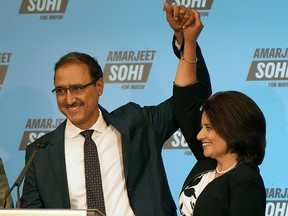 Amarjeet Sohi celebrates with his wife Sarbeet at the Matrix Hotel in Edmonton on Monday, Oct. 18, 2021 after being elected mayor of Edmonton.
