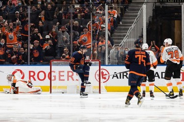 Edmonton Oilers' Zach Hyman (18) celebrates a goal on Philadelphia Flyers' goaltender Carter Hart (79) during second period NHL action at Rogers Place in Edmonton, on Wednesday, Oct. 27, 2021.