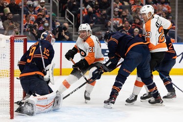 Edmonton Oilers' goaltender Mikko Koskinen (19) stops Philadelphia Flyers' Scott Laughton (21) during second period NHL action at Rogers Place in Edmonton, on Wednesday, Oct. 27, 2021.