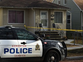 The police Forensic Unit out front of this home at 11345 91 St. surrounded by yellow tape in Edmonton, October 29, 2021. Ed Kaiser/Postmedia