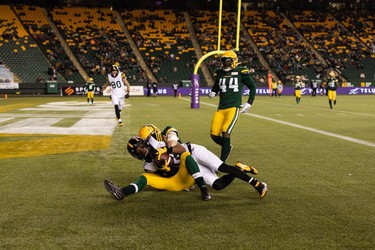 Hamilton Tiger-Cats' Tim White (12) scores a touchdown on the Edmonton Elks during first half CFL action at Commonwealth Stadium in Edmonton, on Friday, Oct. 29, 2021.