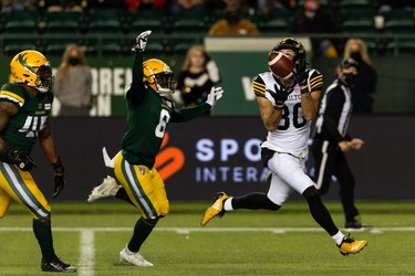 Hamilton Tiger-Cats' Jaelon Acklin (80) scores a touchdown on the Edmonton Elks during first half CFL action at Commonwealth Stadium in Edmonton, on Friday, Oct. 29, 2021.