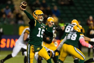 Edmonton Elks' quarterback Taylor Cornelius (15) throws the ball against the Hamilton Tiger-Cats during first half CFL action at Commonwealth Stadium in Edmonton, on Friday, Oct. 29, 2021.