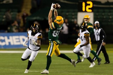 Edmonton Elks' Greg Ellingson (82) fumbles a pass from quarterback Taylor Cornelius (15) against the Hamilton Tiger-Cats during first half CFL action at Commonwealth Stadium in Edmonton, on Friday, Oct. 29, 2021.