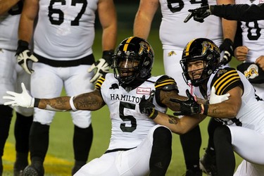 Hamilton Tiger-Cats' Don Jackson (5) celebrates a touchdown with teammates on the Edmonton Elks during second half CFL action at Commonwealth Stadium in Edmonton, on Friday, Oct. 29, 2021.
