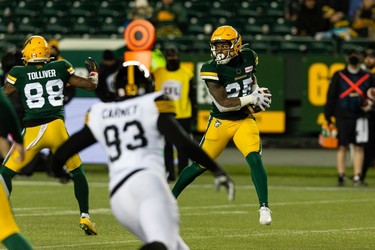 Edmonton Elks' Walter Fletcher (25) catches a throw from quarterback Taylor Cornelius (15) on the Hamilton Tiger-Cats during second half CFL action at Commonwealth Stadium in Edmonton, on Friday, Oct. 29, 2021.