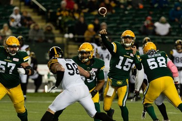 Edmonton Elks' Mike Jones (12) throws the ball on the Hamilton Tiger-Cats during second half CFL action at Commonwealth Stadium in Edmonton, on Friday, Oct. 29, 2021.