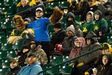 Edmonton Elks fans dance in the stands as the team plays the Hamilton Tiger-Cats during second half CFL action at Commonwealth Stadium in Edmonton, on Friday, Oct. 29, 2021.