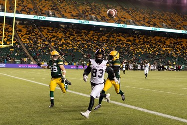 Hamilton Tiger-Cats' David Ungerer III (83) chases a ball ahead of Edmonton Elks defence during second half CFL action at Commonwealth Stadium in Edmonton, on Friday, Oct. 29, 2021.