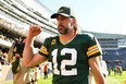 Aaron Rodgers #12 of the Green Bay Packers celebrates after the Packers defeated the Chicago Bears 24-14 at Soldier Field on October 17, 2021 in Chicago, Illinois.