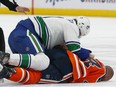 Edmonton Oilers forward Zack Kassian (44) is injured during a fight with Vancouver Canucks forward Zack MacEwen (71) at Rogers Place on Thursday, Oct. 7, 2021.