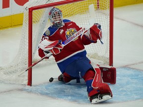 Edmonton Oil Kings goalie Sebastian Cossa makes a save during the Western Hockey League season opener in Edmonton on Friday October 1, 2021.