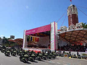 Members of the army participate in the national day celebration in Taipei, Taiwan, Sunday, Oct. 10, 2021.