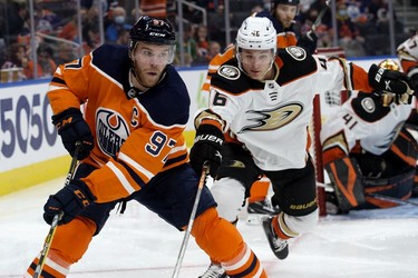 The Edmonton Oilers' Connor McDavid (C) (97) battles the Anaheim Ducks' Trevor Zegras (46) during third period NHL action at Rogers Place, in Edmonton Tuesday Oct. 19, 2021.