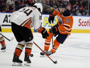 The Edmonton Oilers' Leon Draisaitl (A) (29) battles the Anaheim Ducks' Jamie Drysdale (34) during first period NHL action at Rogers Place, in Edmonton Tuesday Oct. 19, 2021.
