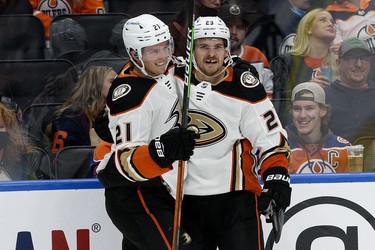 The Anaheim Ducks' Isac Lundestrom (21) and Sam Steel (23) celebrate a second period goal against the Edmonton Oilers during NHL action at Rogers Place, in Edmonton Tuesday Oct. 19, 2021.