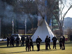 While most of the camp protesting COVID-19 vaccinations, Indigenous injustices have been removed from Alberta legislature grounds a few teepees remain with a large police presence staying close by on Monday, Oct. 25, 2021 in Edmonton . Greg Southam-Postmedia