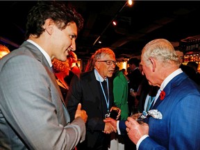 Prime Minister Justin Trudeau, left, speaks with American businessman Bill Gates and Prince Charles, the Prince of Wales, during the UN Climate Change Conference COP26 in Glasgow, Scotland, on Tuesday, Nov. 2, 2021.