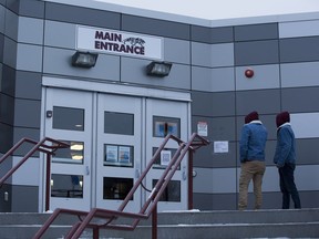 Students enter Percy Page High School in January to pick up computers so they can work from home, an option for learning that parents can now choose for their children for the second half of the 2021-2022 school year, Edmonton Public Schools announced on Tuesday. Greg Southam-Postmedia