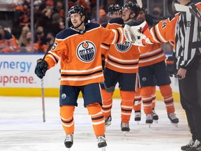 Edmonton Oilers' Kailer Yamamoto (56) celebrates a goal with teammates on Nashville Predators' goaltender Connor Ingram (39) during second period NHL action at Rogers Place in Edmonton, on Wednesday, Nov. 3, 2021.