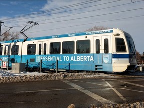 An LRT train crosses a road after leaving the the South Campus LRT station at the University of Alberta on Nov. 19, 2021.