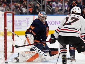 Edmonton Oilers goaltender Stuart Skinner (74) makes a save on the Chicago Blackhawks at Rogers Place in Edmonton on Nov. 20, 2021.