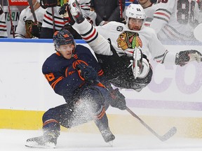 Edmonton Oilers defensemen Philip Broberg (86) checks Chicago Blackhawks defensemen Erik Gustafsson (56) during the third period at Rogers Place.