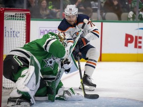 Dallas Stars goaltender Jake Oettinger (29) stops a shot by Edmonton Oilers center Colton Sceviour (70) during the first period at the American Airlines Center on Nov. 23, 2021.