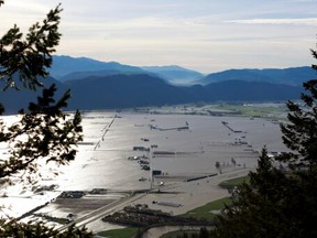Flooded houses and farms are seen from the top of Sumas Mountain after rainstorms caused flooding and landslides in Abbotsford, British Columbia, Canada, on Nov. 17, 2021.