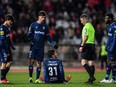 Belenenses' goalkeeper Joao Monteiro sits on the pitch at the end of the the Portuguese league match between Belenenses SAD and SL Benfica at the Jamor stadium in Oeiras, Portugal, Nov. 27, 2021.
