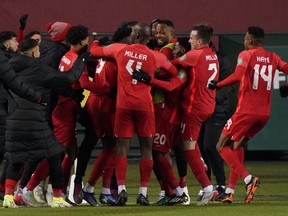 Team Canada celebrates after Jonathan David (20) scored against Team Costa Rica during a FIFA 2022 World Cup qualifier soccer match held at Commonwealth Stadium in Edmonton, Canada on Friday November 12, 2021. Team Canada won the game 1-0.