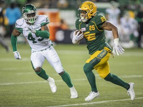 Saskatchewan Roughriders' Deon Lacey (45) chases Edmonton Elks' Walter Fletcher (25) during first half CFL action in Edmonton on Friday, November 5, 2021.  The Elks lost 29-24 to the Roughriders in Regina, Sask.,on Saturday.