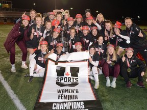 The MacEwan University women's soccer team celebrates its national championship title after defeating the Trinity Western Spartans in the U SPORT final in Cape Breton, N.S., on Nov. 21, 2021.