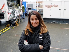 Alba Campabadal, vice president of One Soccer and head of production, stands by broadcast trucks outside Commonwealth Stadium in Edmonton, site of two FIFA 2022 World Cup qualifier soccer matches.