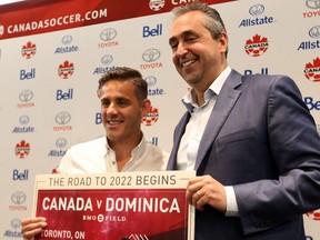 Men's national team head coach John Herdman, left, and Peter Montopoli, Canada Soccer General Secretary announce the Canada v Dominica friendly at the Intercontinental Toronto Centre in Toronto, Ont. on Tuesday July 17, 2018.