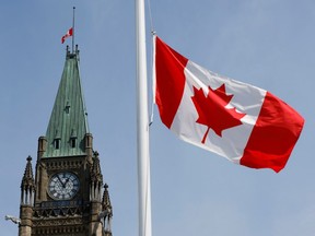 File photo of a Canadian flag flying at half-mast on Parliament Hill in Ottawa.