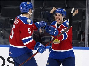 The Edmonton Oil Kings' Jalen Luypen (23) celebrates a goal with Simon Kubicek (5) during third period WHL action against the Red Deer Rebels at Rogers Place, in Edmonton Wednesday, Nov. 24, 2021. The Oil Kings won 5 to 3.