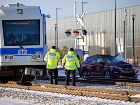 One person was taken to hospital after an Edmonton Transit Services LRT train collided with a motor vehicle near 66 Street and 125 Avenue in Edmonton on Wednesday morning, November 24, 2021. (PHOTO BY LARRY WONG/POSTMEDIA)