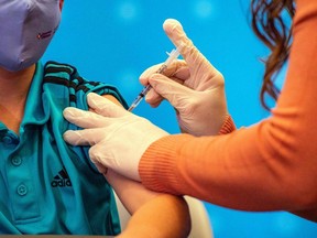 Canada could approve COVID-19 vaccine doses for children ages 5-11 as soon as Friday. (Photo by JOSEPH PREZIOSO / AFP)