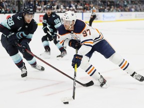 Connor McDavid (97) of the Edmonton Oilers controls the puck against the Seattle Kraken at Climate Pledge Arena on Dec. 03, 2021, in Seattle.