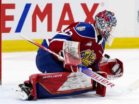 The Edmonton Oil Kings' goaltender Sebastian Cossa (33) makes a save during second period WHL action against the Red Deer Rebels at Rogers Place, in Edmonton Wednesday Nov. 24, 2021.