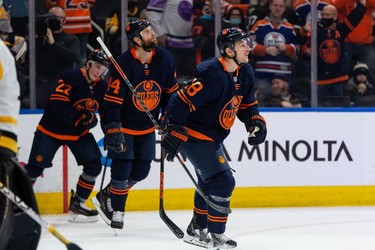 Edmonton Oilers' Zach Hyman (18) celebrates a goal with teammates on Pittsburgh Penguins' goaltender Tristan Jarry (35)  during first period NHL action at Rogers Place in Edmonton, on Wednesday, Dec. 1, 2021.