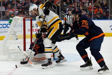 Edmonton Oilers' goaltender Mikko Koskinen (19) stops Pittsburgh Penguins' Jeff Carter (77) during second period NHL action at Rogers Place in Edmonton, on Wednesday, Dec. 1, 2021.